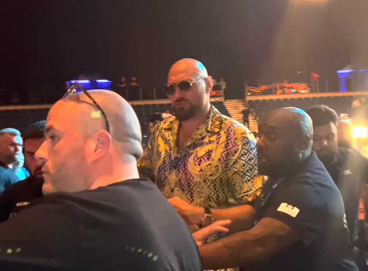 Tyson Fury is forced to shoo off a fan who attempted to take a selfie with the heavyweight boxing champ