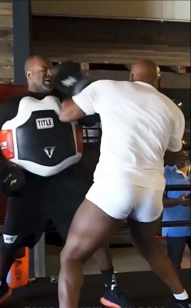 Mike Tyson hits trainer with a huge punch to the lip as the 55-year-old boxing legend prepares for a possible comeback