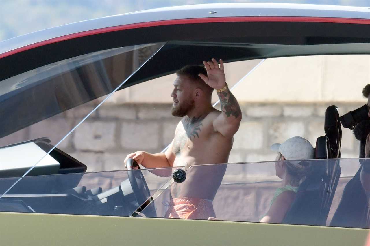 Conor McGregor takes Dee Devlin on a spin as he drives his PS2.7m Lamborghini Yacht across the south coast of France.