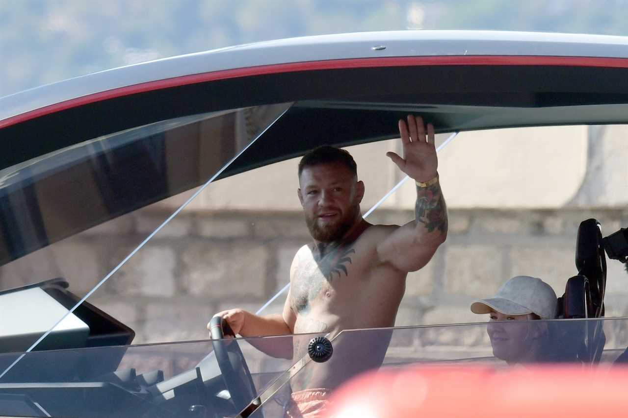 Conor McGregor takes Dee Devlin on a spin as he drives his PS2.7m Lamborghini Yacht across the south coast of France.