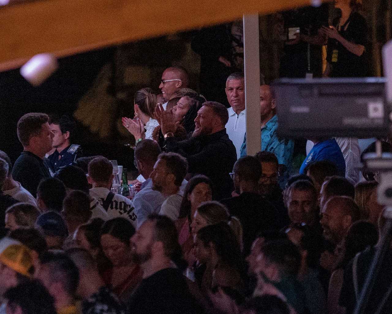 Conor McGregor, UFC fighter, hangs out with Jared Leto. He holds a bottle of Proper Number. Twelve whiskys at Kendrick Lasmar concert