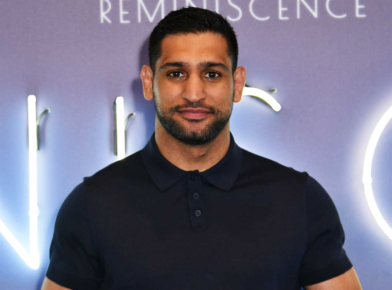 Three men were arrested after Amir Khan, a boxer, robbed him at gunpoint in east London for a PS72k watch