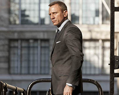 Conor McGregor, who is facing driving charges, compares himself with James Bond when he arrives in court wearing a three-piece suit.