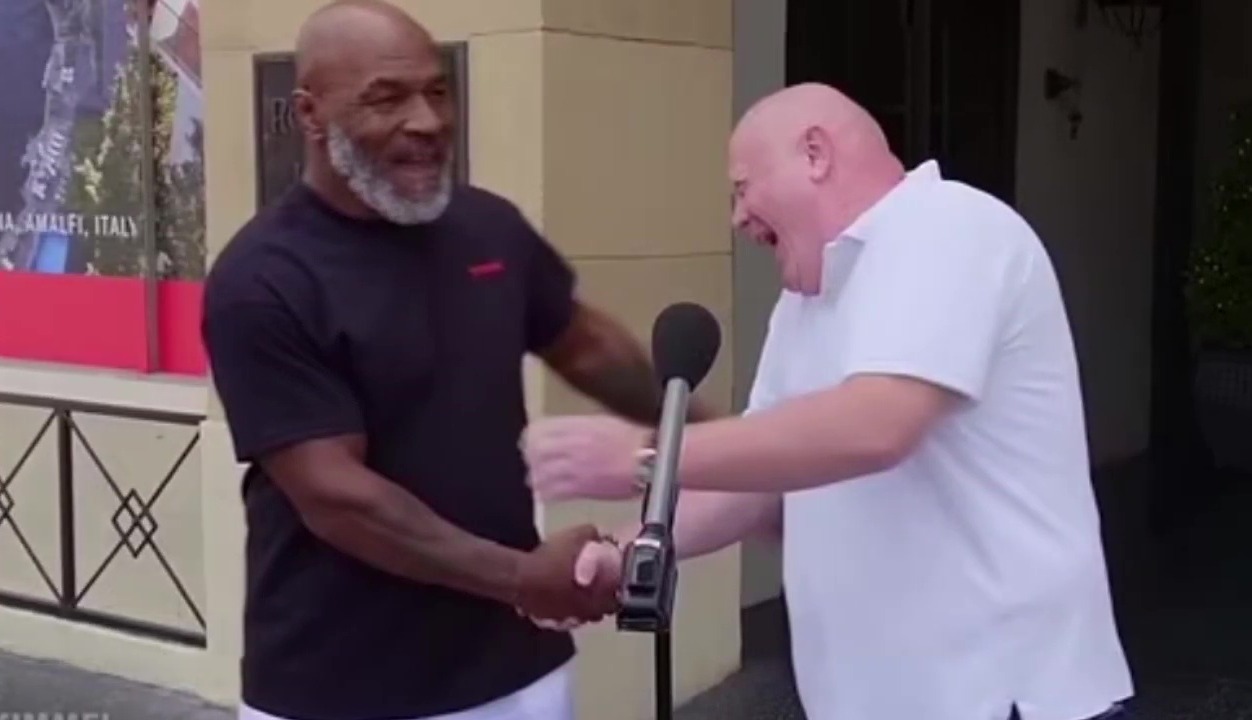Watch the hilarious moment Mike Tyson appears behind a tourist who claimed that he would be able to get in ring boxing legend.