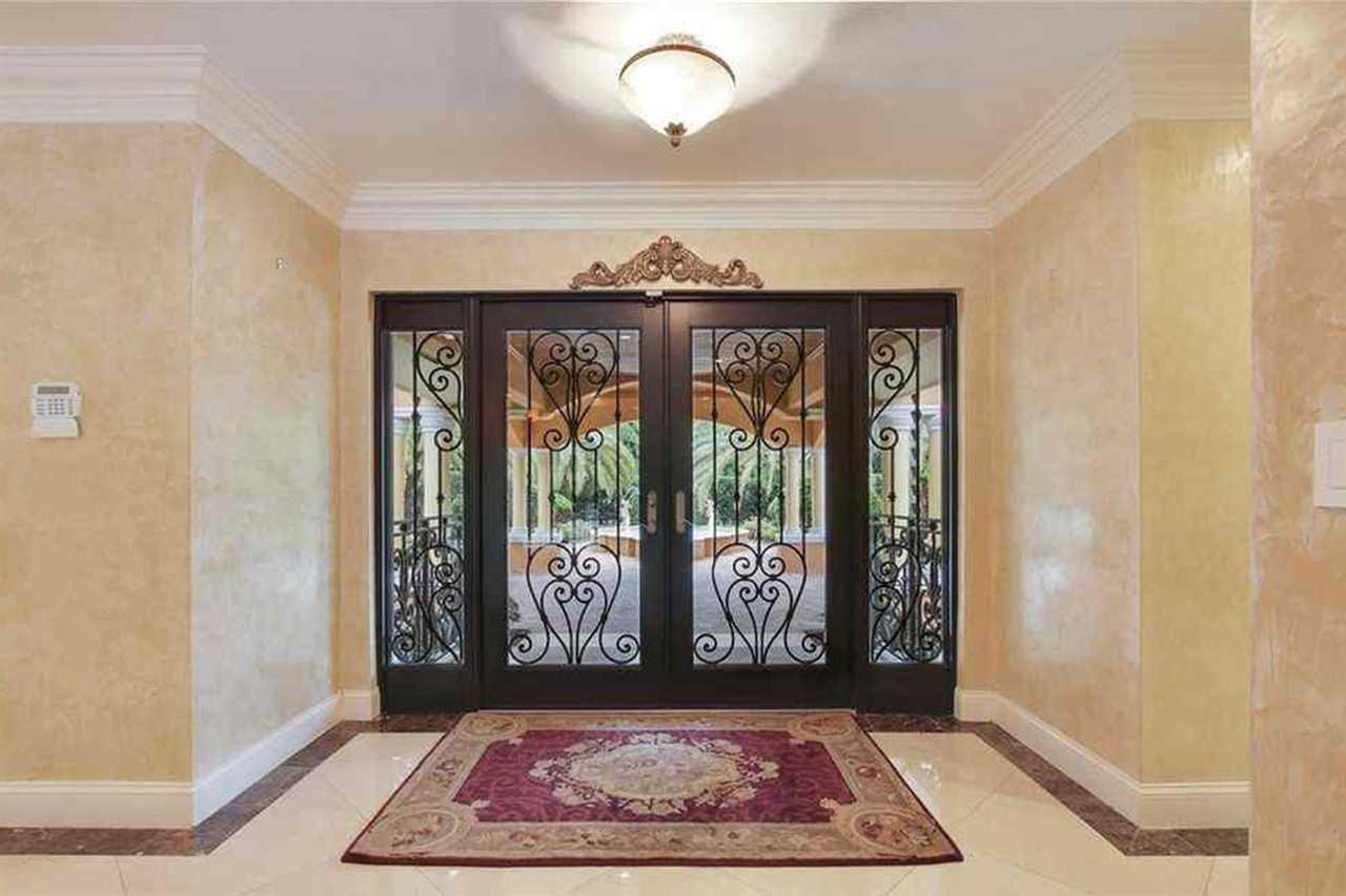 Jorge Masvidal, UFC fighter, owns a stunning PS1.6m Miami home that was inspired by Scarface. It features a Koi pond and marble floors.