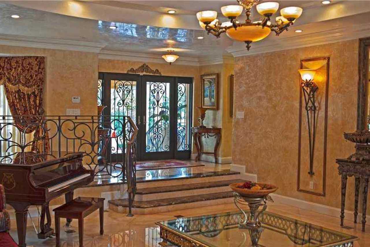 Jorge Masvidal, UFC fighter, owns a stunning PS1.6m Miami home that was inspired by Scarface. It features a Koi pond and marble floors.