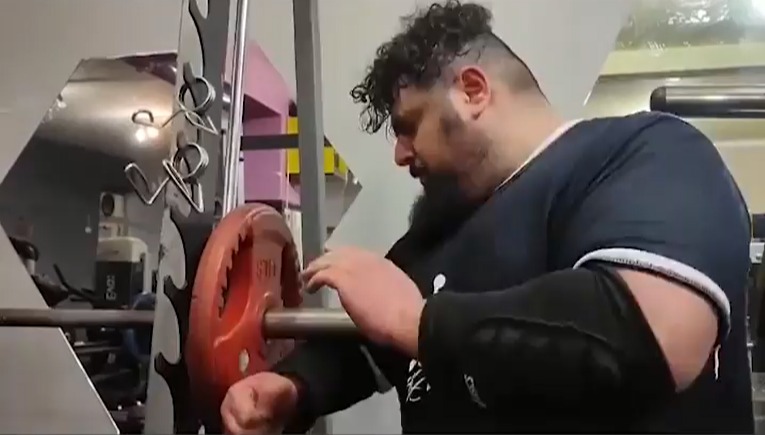 Watch Iranian Hulk punch a metal weight during a bizarre training program for Kazakh Titan fight