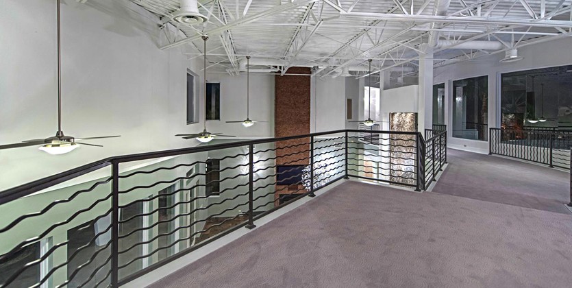 The wrought iron staircase runs through the home