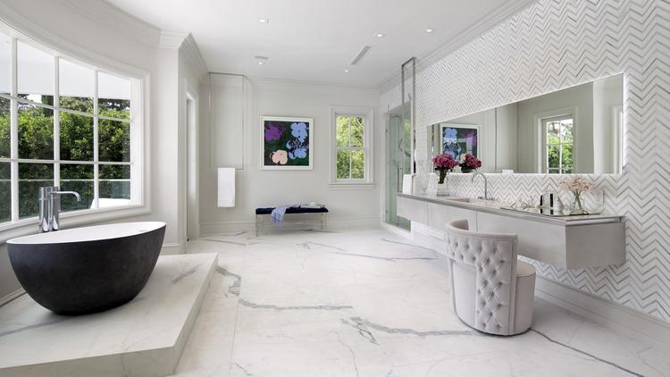 One of the ten bathrooms throughout the luxury pad