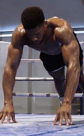 As Anthony Joshua, a henchman, performs a grueling wrist exercise to show off his incredible physique while training for the Usyk fight.