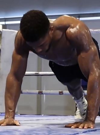 As Anthony Joshua, a henchman, performs a grueling wrist exercise to show off his incredible physique while training for the Usyk fight.