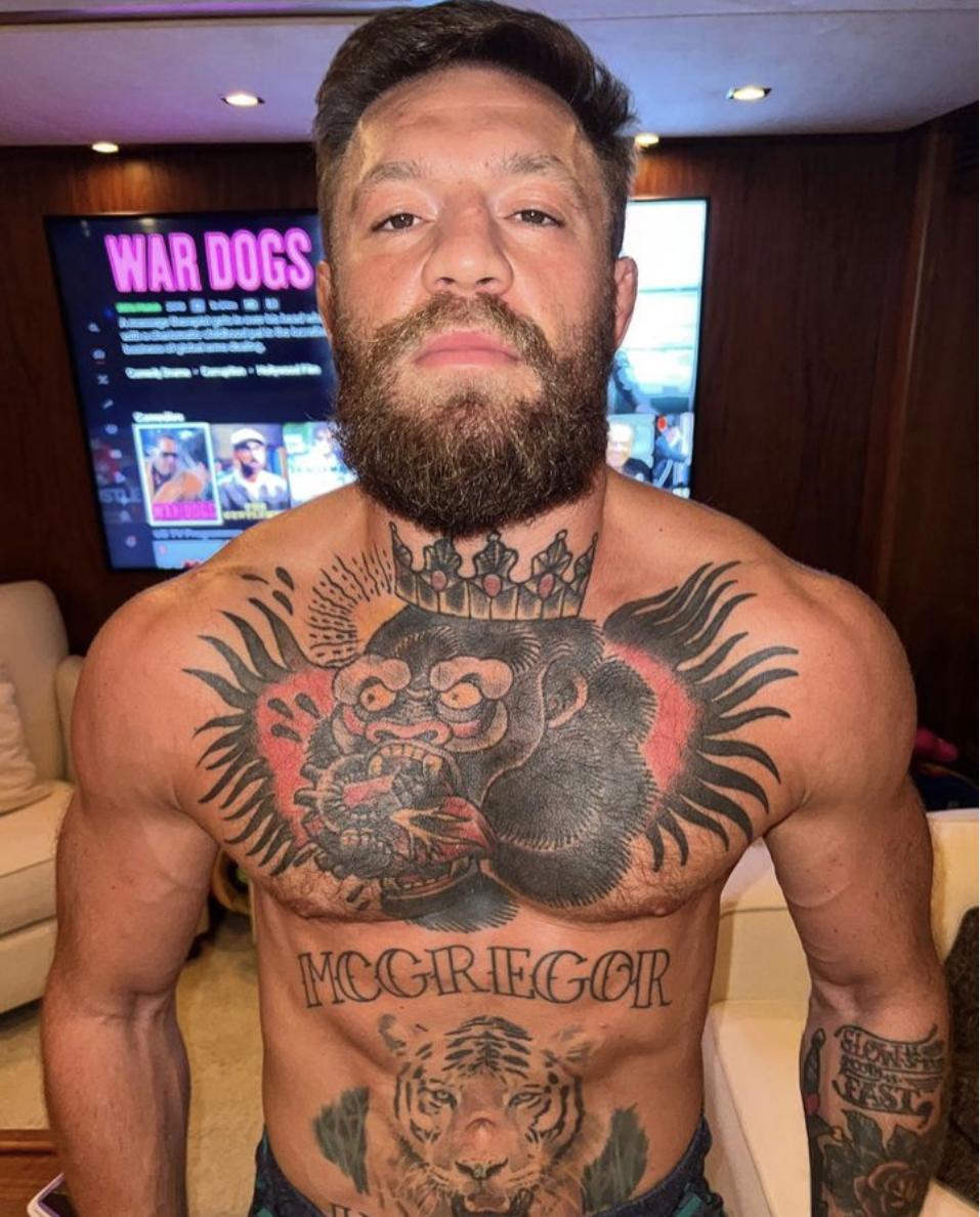Conor McGregor, UFC fighter, shows off his ripped body after doing'spinal wave' exercises to give him a good workout.