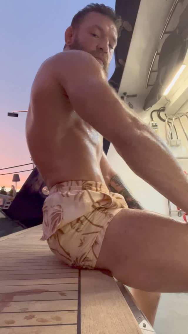 Conor McGregor, UFC fighter, shows off his ripped body after doing'spinal wave' exercises to give him a good workout.
