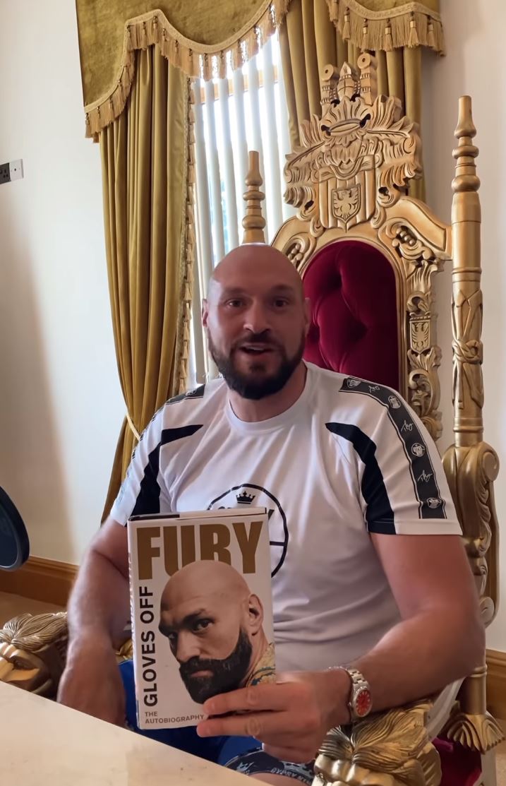 Tyson Fury relaxes on gold THRONE at his home, after receiving a prop from Deontay wilder fight