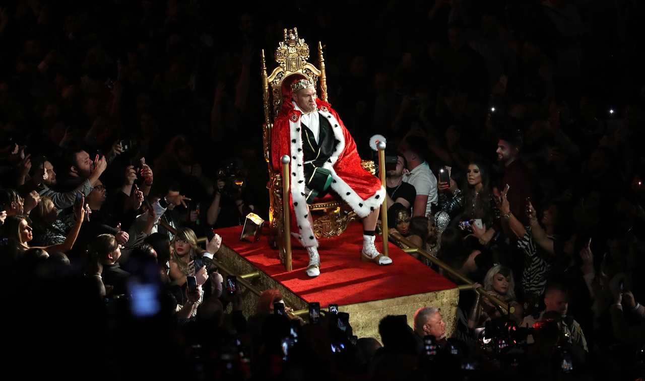 Tyson Fury relaxes on gold THRONE at his home, after receiving a prop from Deontay wilder fight