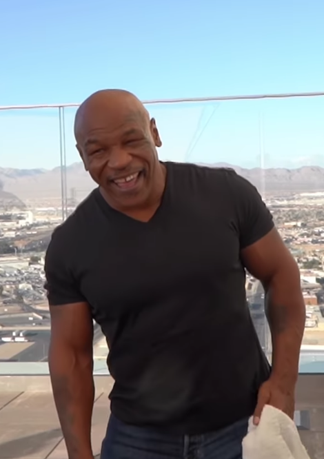 Watch Mike Tyson laugh as he recalls UFC chief Dana White giving him a job fighting a SHARK.