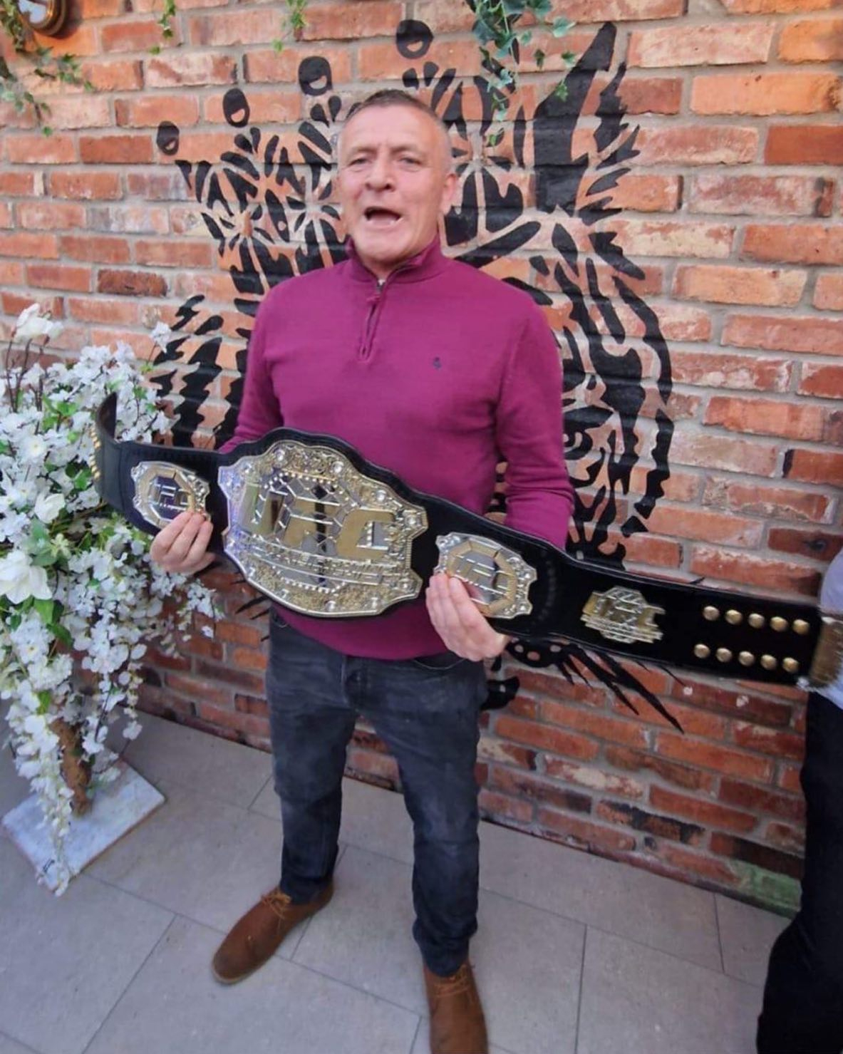 Conor McGregor shares a pic of Dan holding the UFC star's belt and pays tribute to him.