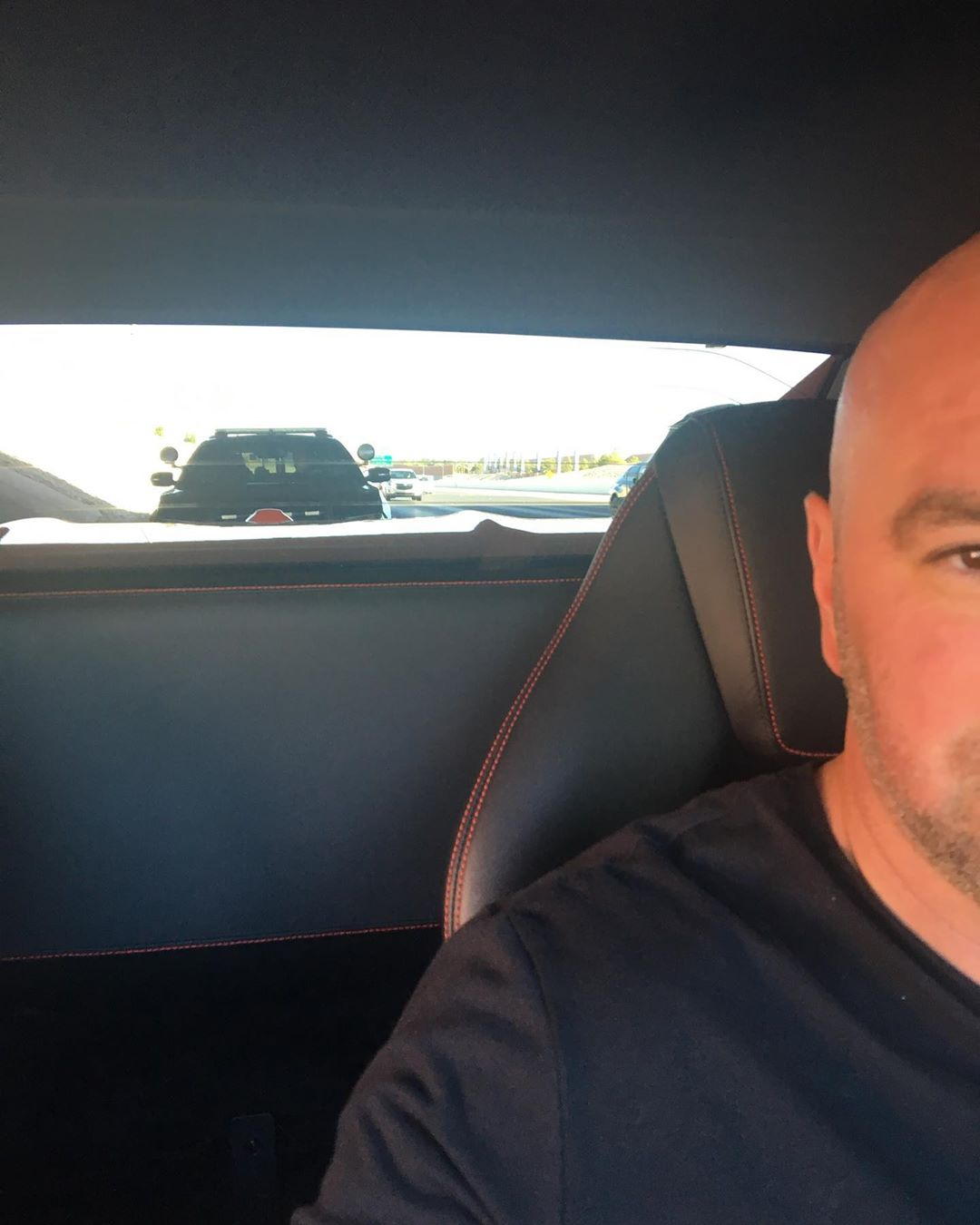 White gets behind the wheel of his Ferrari
