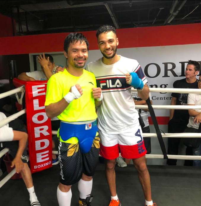 Manny Pacquiao talks to Jaber Zayani, his former sparring partner in a Saudi Arabia exhibition bout.