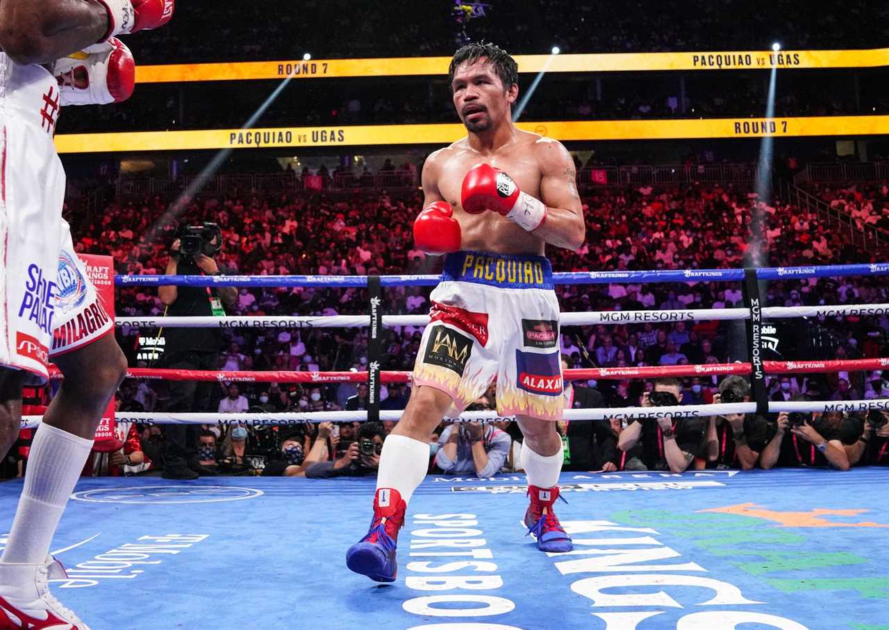 Manny Pacquiao talks to Jaber Zayani, his former sparring partner in a Saudi Arabia exhibition bout.