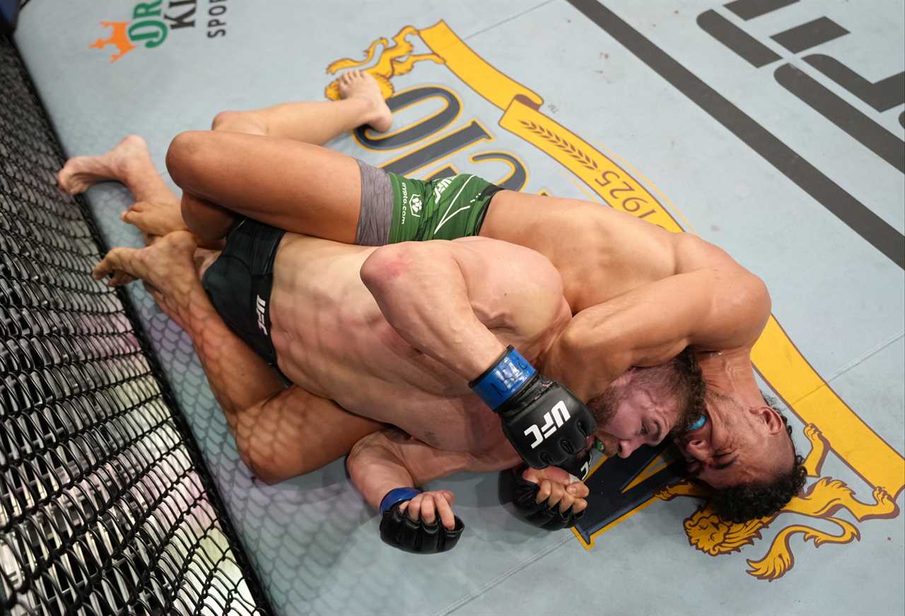 Johnny Walker kisses his KO opponent before he is THROWN AWAY from the arena at UFC 279 without shoes after winning fight