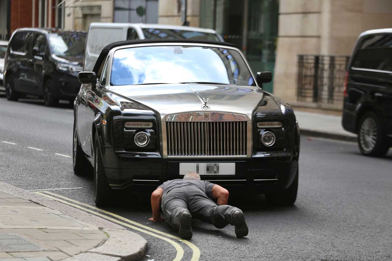 Chris Eubank drives his designer bag repeatedly while parking PS300k Rolls Royce. He then gets help from passers-by