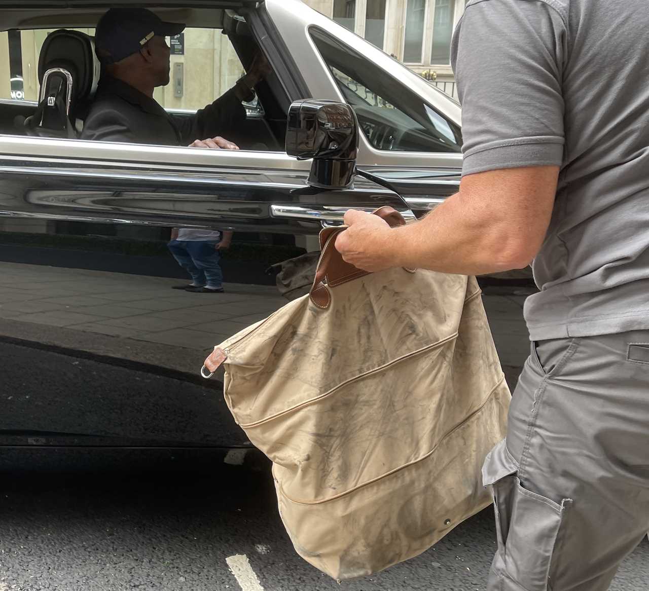 Chris Eubank drives his designer bag repeatedly while parking PS300k Rolls Royce. He then gets help from passers-by