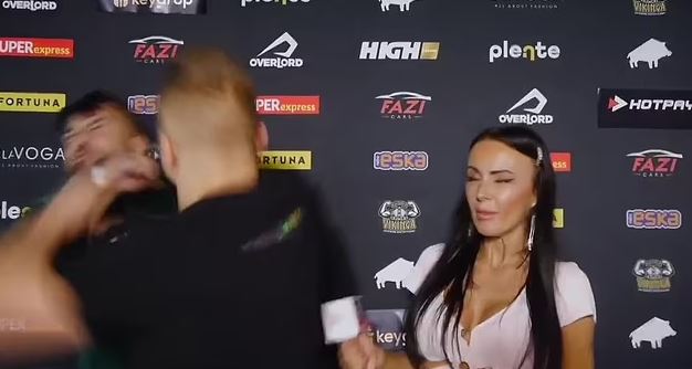 Disgraceful moment MMA fighter Amadeusz Ferrari SUCKER PUNCHES YouTube star in the face during TV interview