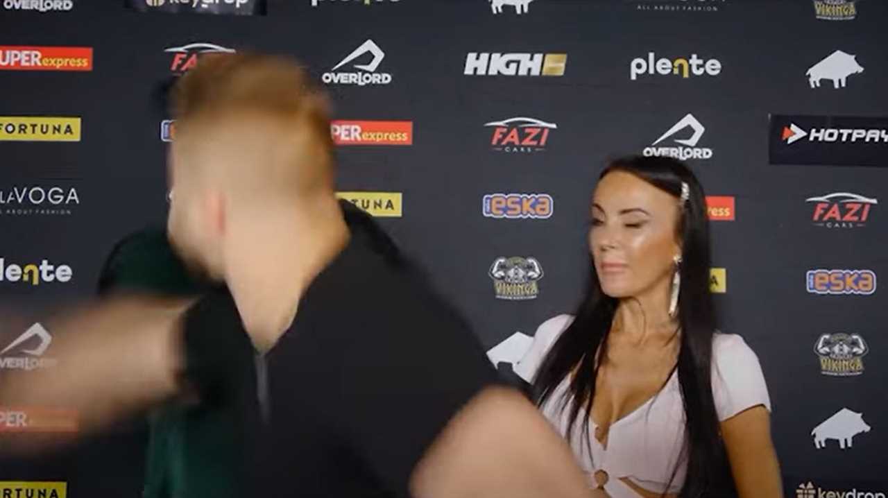 Disgraceful moment MMA fighter Amadeusz Ferrari SUCKER PUNCHES YouTube star in the face during TV interview