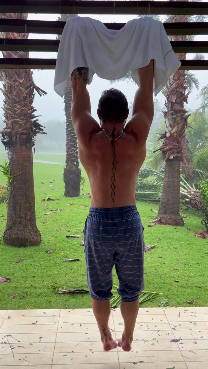 Conor McGregor, the top UFC fighter, performs grueling shoulder exercises in hurricane during holiday