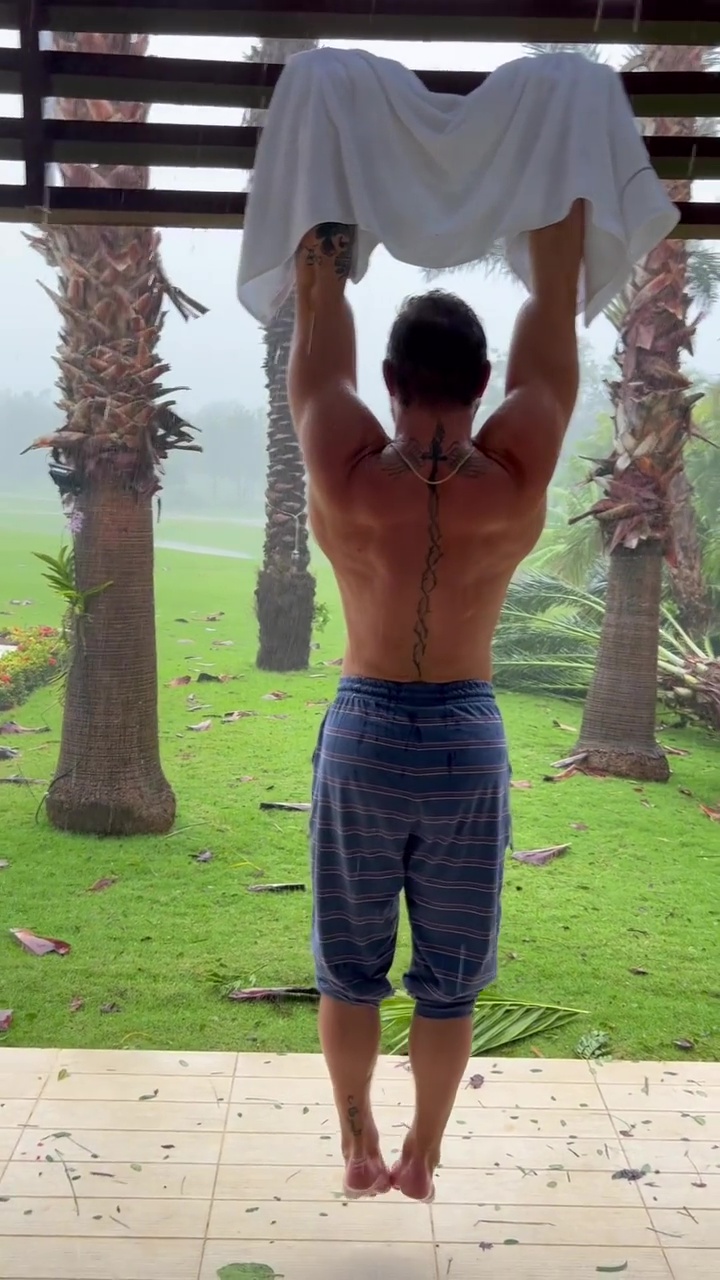 Conor McGregor, the top UFC fighter, performs grueling shoulder exercises in hurricane during holiday