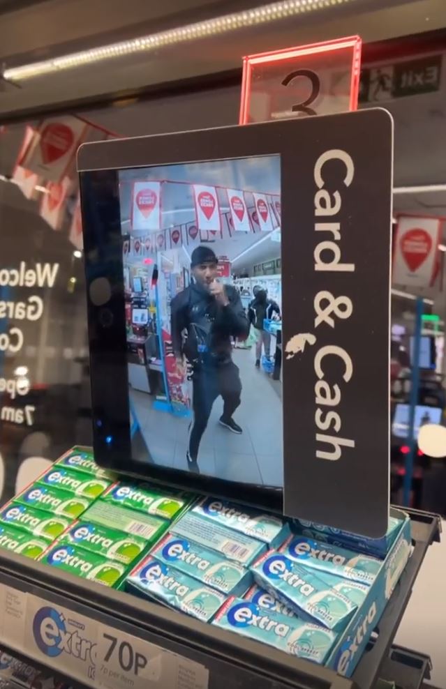 Anthony Joshua shadow boxes in Co-op, while he patiently waits behind the customer