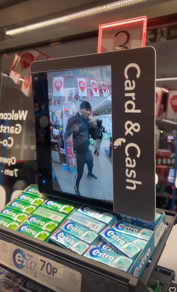 Anthony Joshua shadow boxes in Co-op, while he patiently waits behind the customer