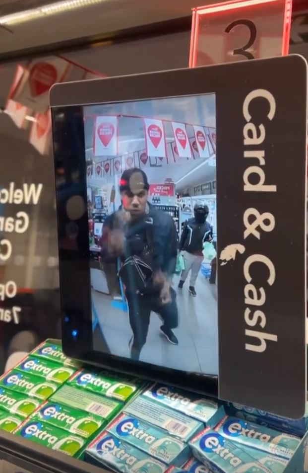 Anthony Joshua shadow boxes in Co-op, while he patiently waits behind the customer
