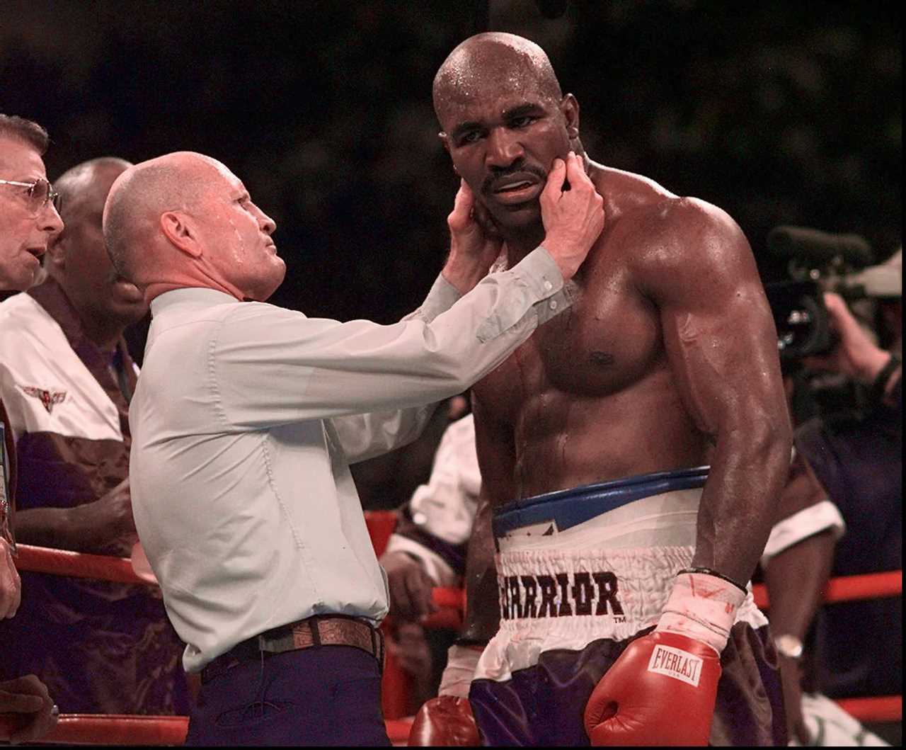 Ref Mills Lane is hugged by Mike Tyson in a touching throwback snap, years after he was disqualified for biting Holyfield's ears off