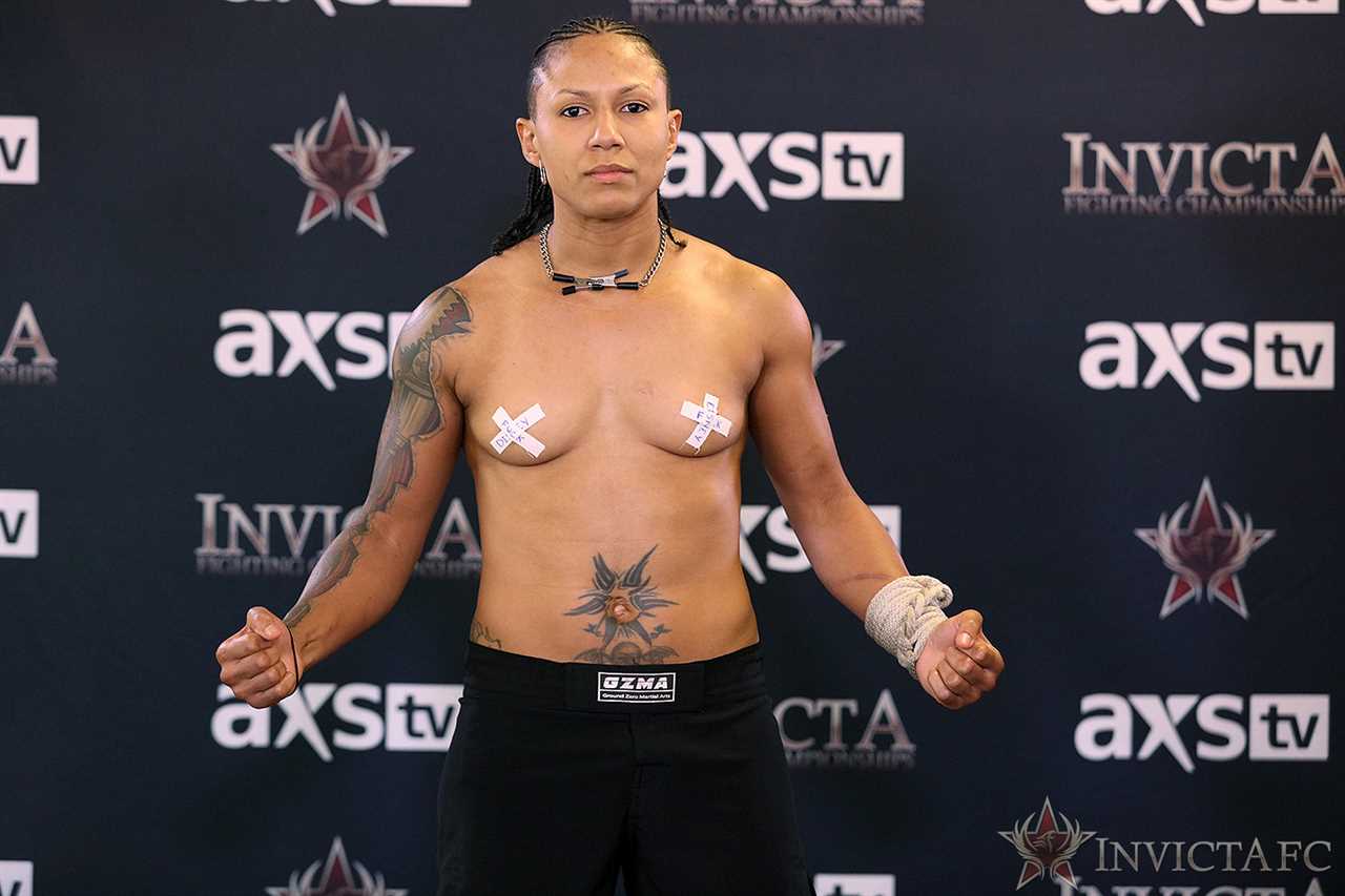 Helen Peralta, MMA star, protests at weigh-in in a topless act of defiance as she continues her attack on Disney