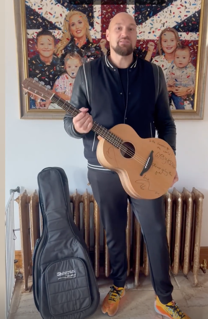 Tyson Fury says he will learn to play Ed Sheeran songs after receiving pop icons gifts Gypsy King signed guitar