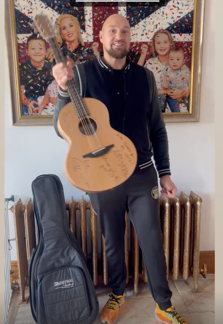 Tyson Fury says he will learn to play Ed Sheeran songs after receiving pop icons gifts Gypsy King signed guitar