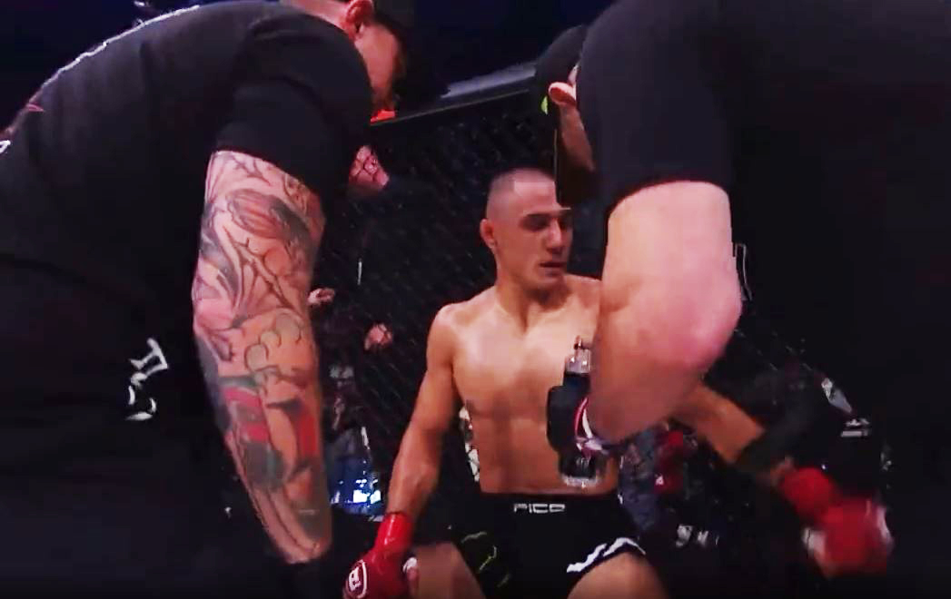 Watch as Aaron Pico, MMA fighter, pushes his cornerman back into the fighter's shoulder after it popped out during bout