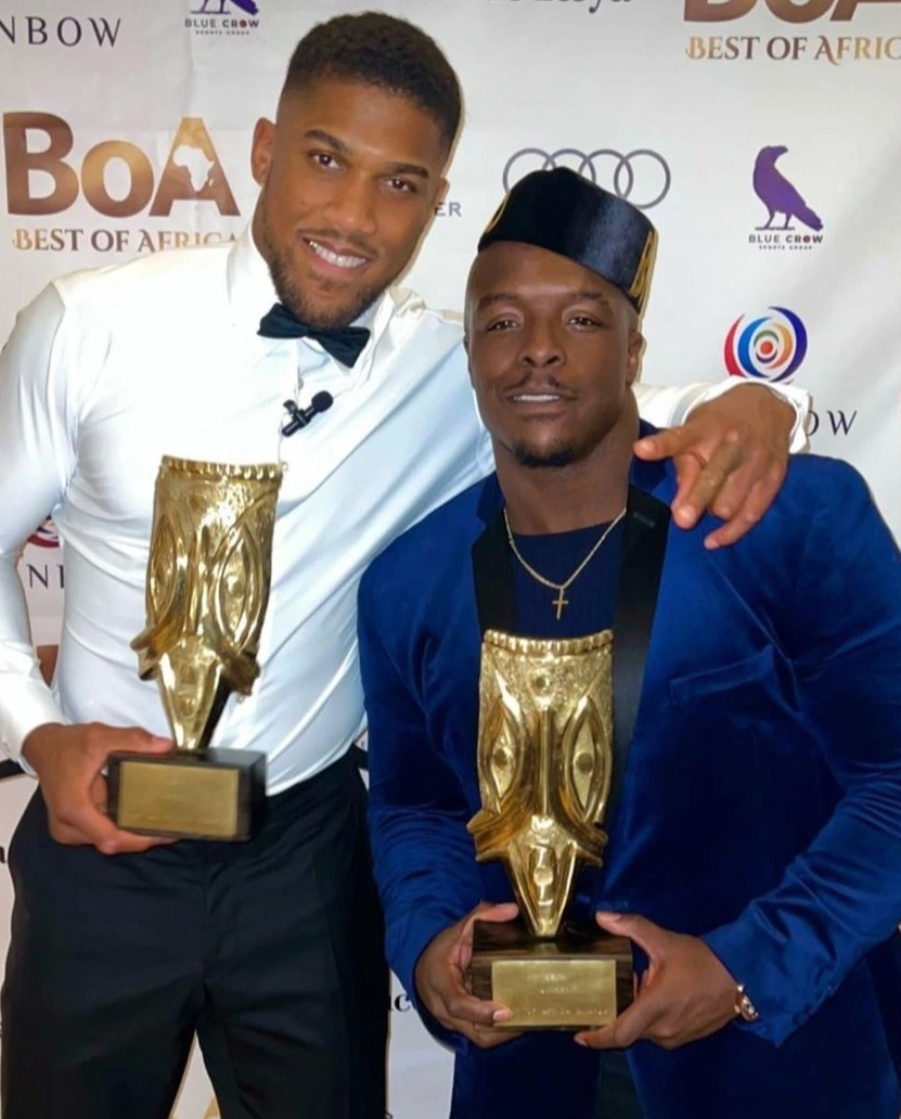 Anthony Joshua, a heavyweight star, looks sharp in a slick suit at the Best of Africa Awards with his pals