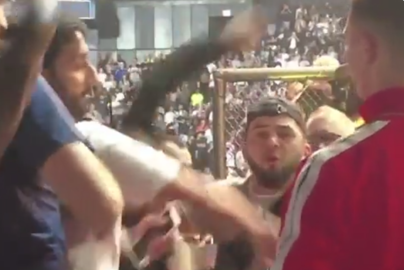Khamzat Chimaev throws punches at Khabib Nurmagomedov’s cousin in cageside brawl at UFC 280 before security rush in