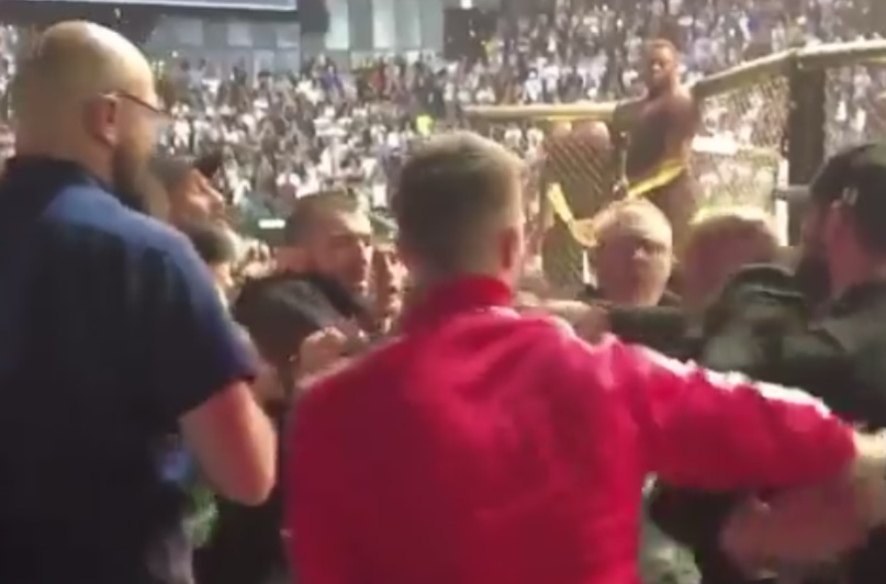 Khamzat Chimaev throws punches at Khabib Nurmagomedov’s cousin in cageside brawl at UFC 280 before security rush in