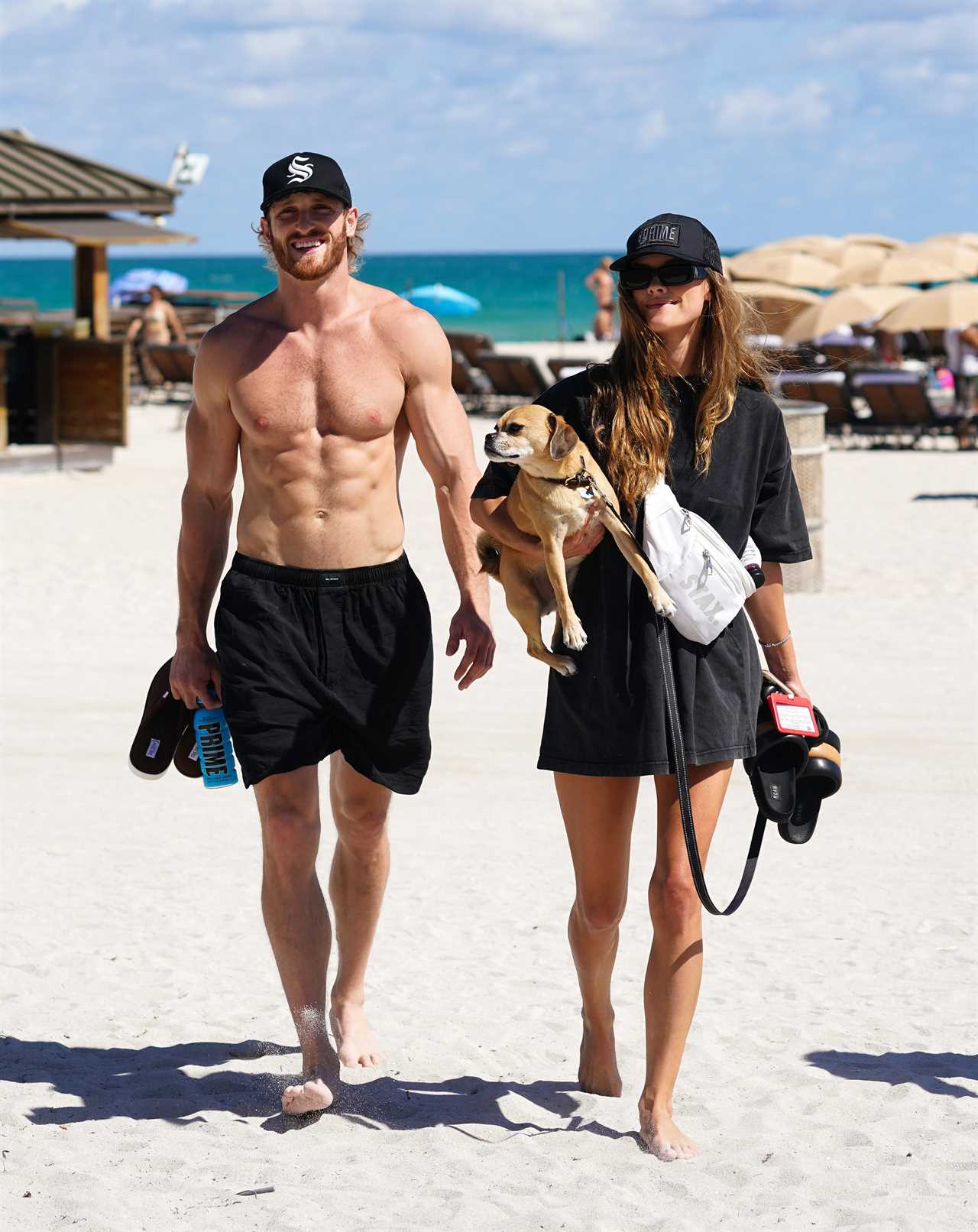 Logan Paul heads for beach break with stunning model girlfriend Nina Agdal ahead of brother Jake’s fight this weekend