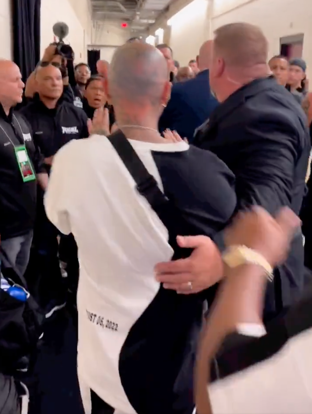 After a shocking 20-man brawl following Anderson Silva fight, watch Nate Diaz punch one of Jake Paul's teammates backstage