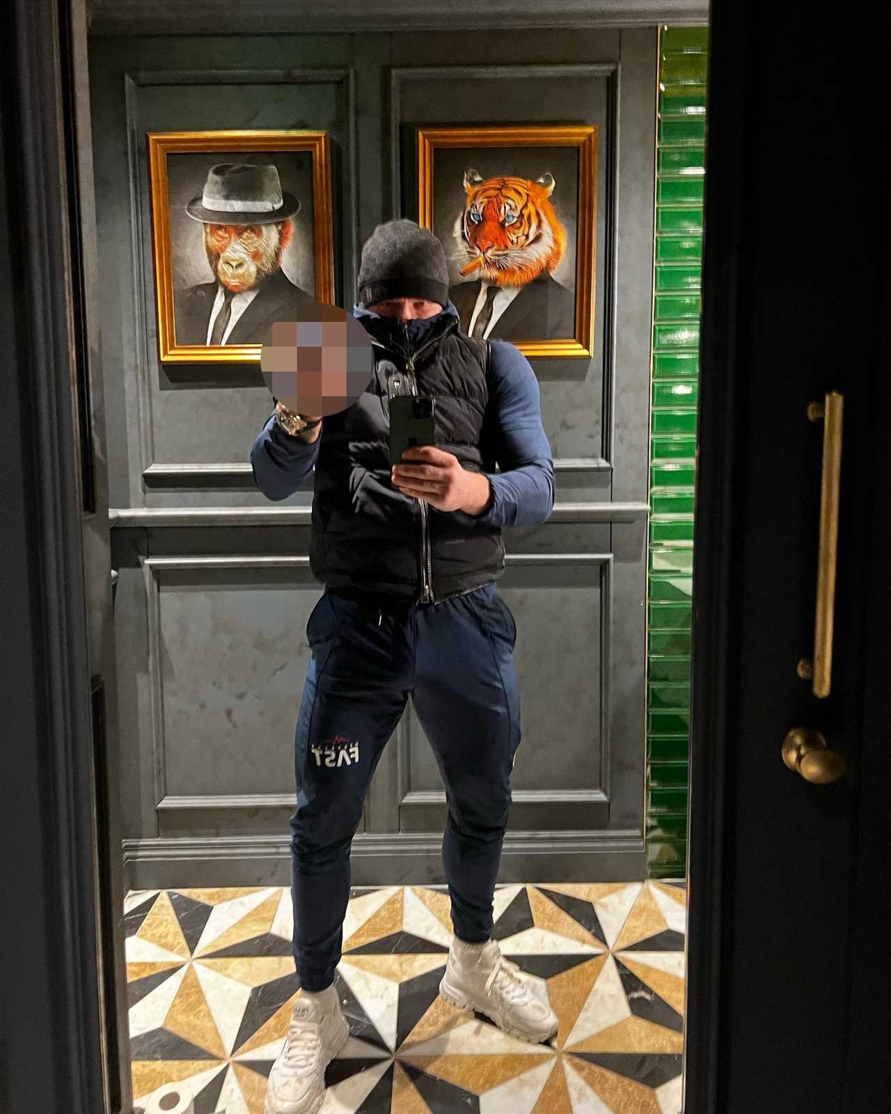 Conor McGregor covers his face with a pint, after being mocked for shaving his beard.