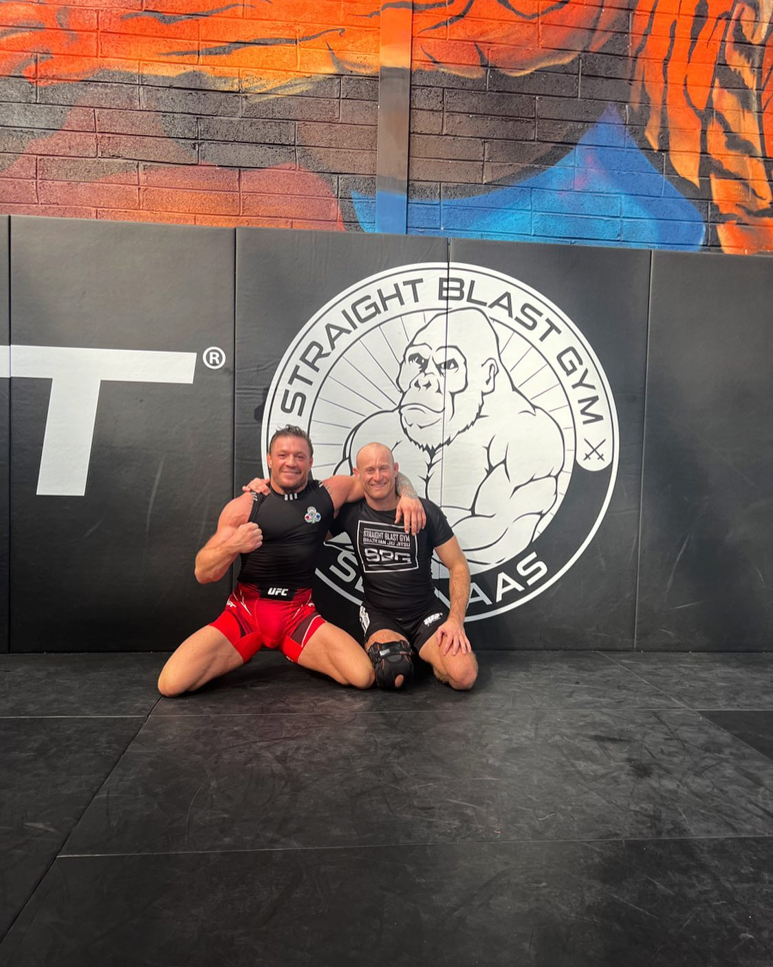 Conor McGregor, UFC star, works on jiu jitsu training. He reveals that his goal is to hit nothing but skull & gut.