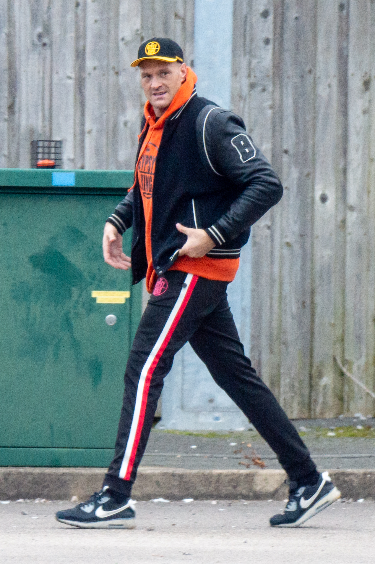 Tyson Fury cleans up the trash as he leaves Morecambe gym in preparation for Derek Chisora fight