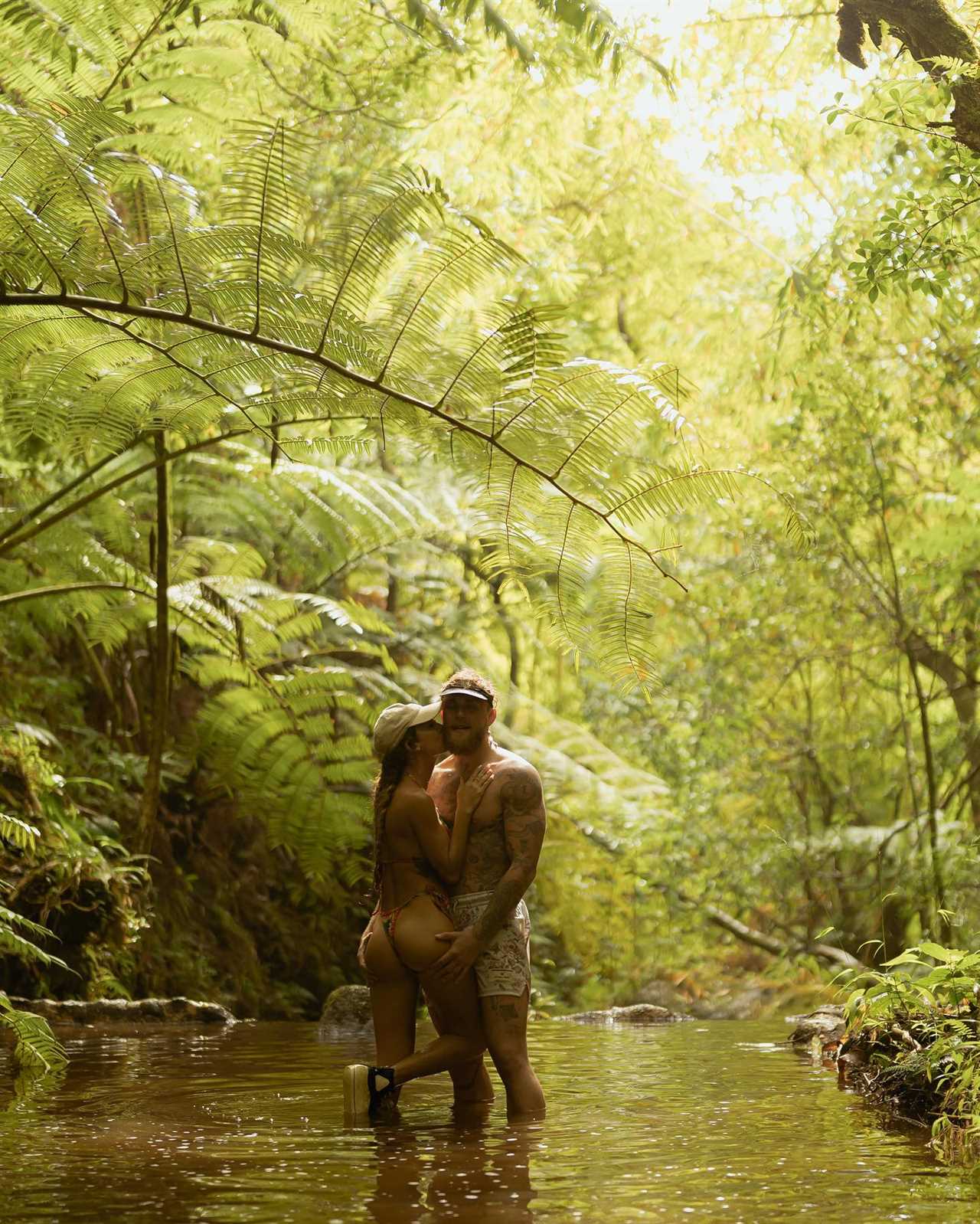 Julia Rose and Jake Paul have little to no imagination as they lounge in a waterfall pool during their Hawaii vacation.