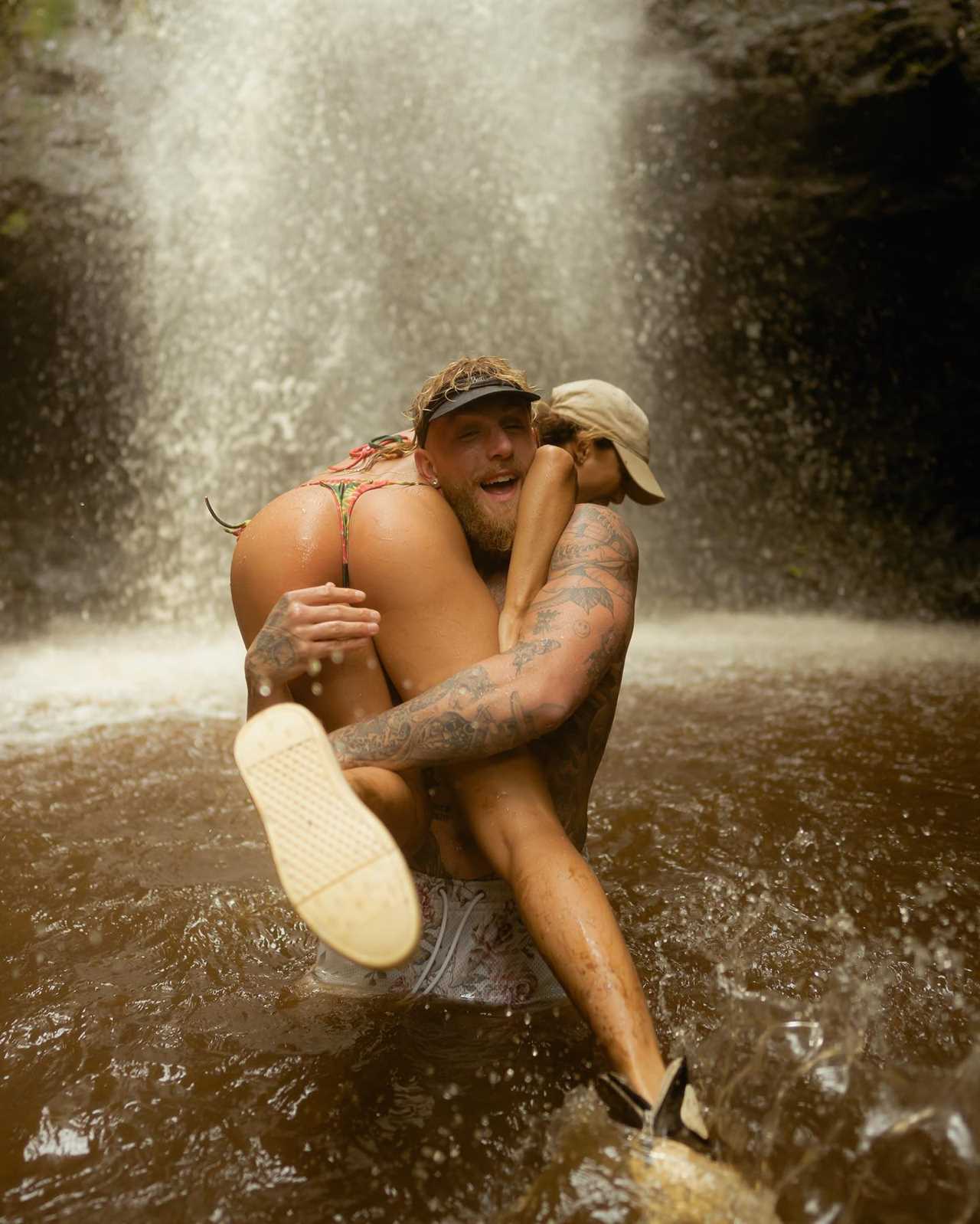 Julia Rose and Jake Paul have little to no imagination as they lounge in a waterfall pool during their Hawaii vacation.