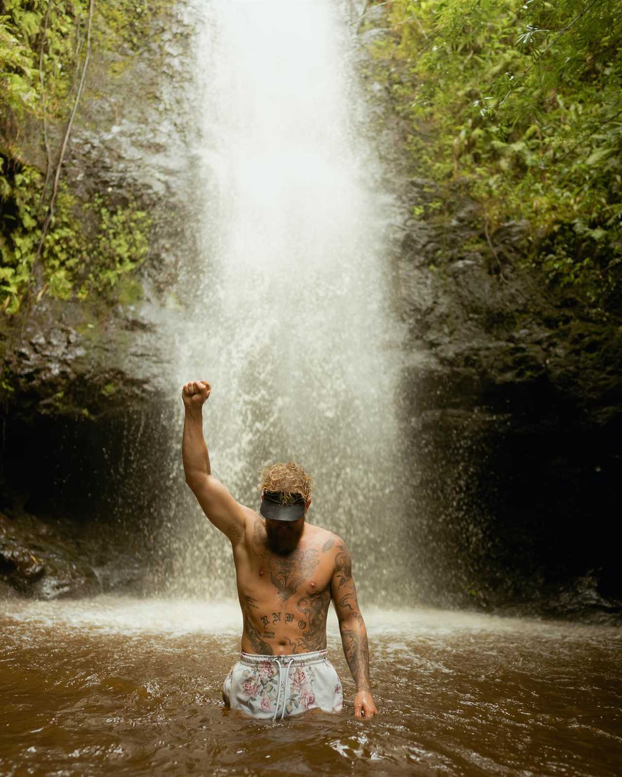 Julia Rose and Jake Paul have little to no imagination as they lounge in a waterfall pool during their Hawaii vacation.